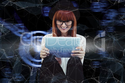 Composite image of smiling hipster woman using her tablet