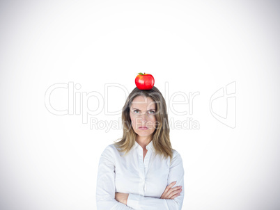 Composite image of businesswoman looking sad with her arms cross