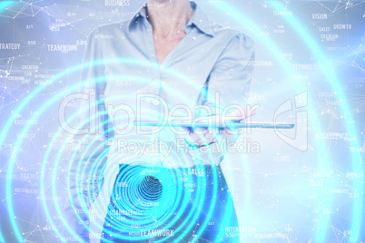 Composite image of businesswoman holding digital tablet