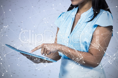 Composite image of cropped image of businesswoman using tablet