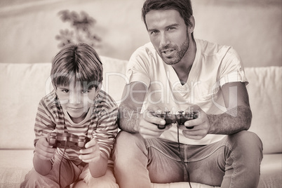 Father and son playing video games