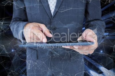 Composite image of  close up view of businessman using tablet co