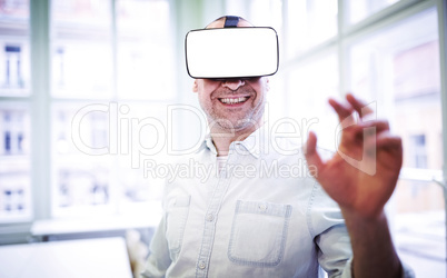 Smiling graphic designer using virtual reality headset