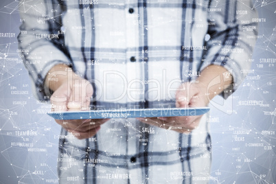 Composite image of casual man using tablet pc