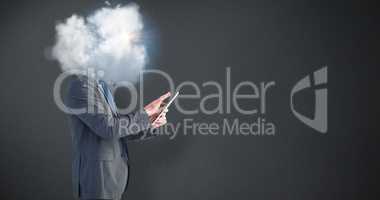 Composite image of businessman using his tablet pc