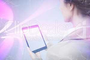 Composite image of businesswoman holding digital tablet on white