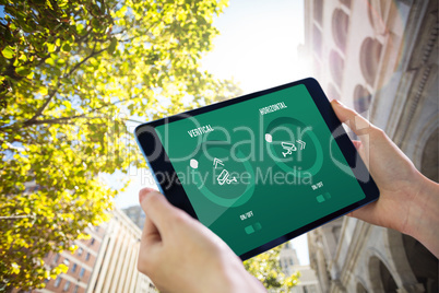 Composite image of hands holding tablet