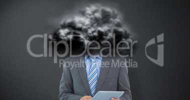 Composite image of businessman using a tablet  with colleagues b