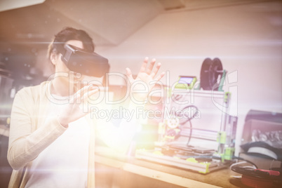 Female graphic designer using the virtual reality headset