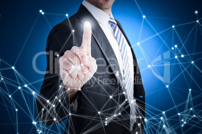 Composite image of businessman pointing with his finger