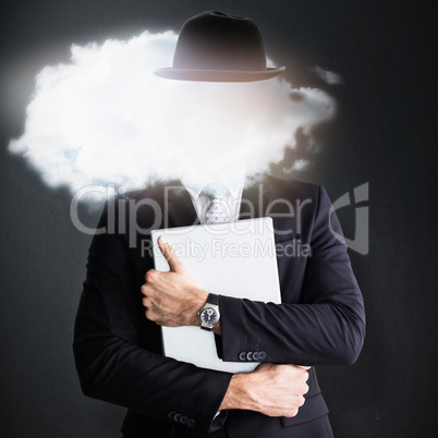 Composite image of mid section of businessman holding computer