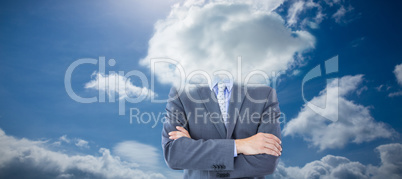 Composite image of midsection of businessman standing arms cross