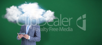 Composite image of businessman using tablet