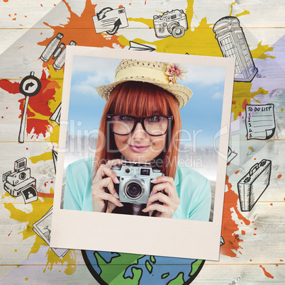 Composite image of portrait of a smiling hipster woman holding r