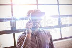 Businessman using virtual reality device