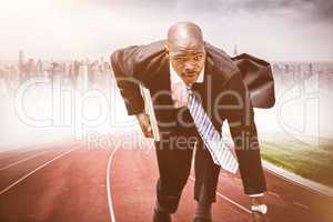 Composite image of businessman in the starting blocks