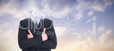 Composite image of mid section of businessman with arms crossed