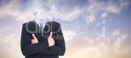 Composite image of mid section of businessman with arms crossed