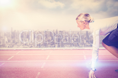 Composite image of businesswoman in the starting blocks