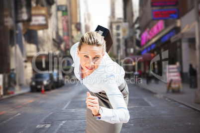 Composite image of businesswoman ready to run