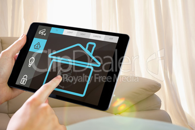 Composite image of man using tablet pc