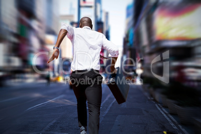 Composite image of businessman jumping a hurdle