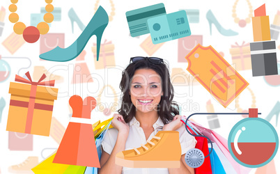 Composite image of pretty brunette with shopping bags