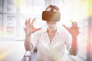 Businesswoman holding virtual glasses