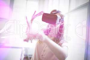 Businesswoman holding virtual glasses