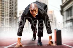 Composite image of businessman in the starting blocks