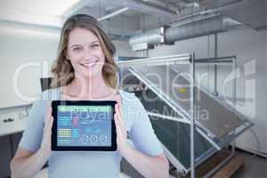 Composite image of portrait of smiling woman with tablet