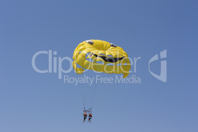 Sport activity Parasailing with smile in sky photo