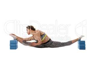 Woman doing stretching using gymnastic bricks