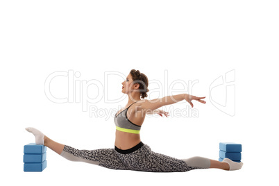 Image of gymnast exercising using gymnastic bricks