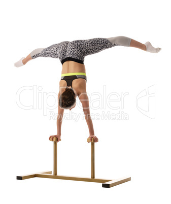 Gymnastics. Girl doing handstand on circus stands