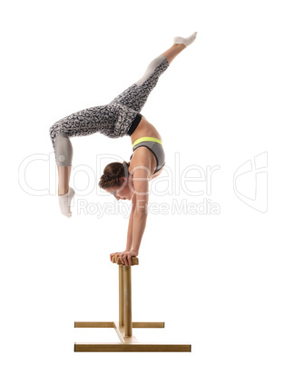 Female acrobat exercising on circus stands
