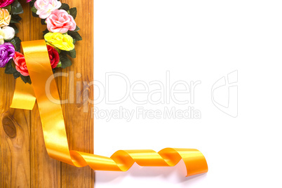 Traditional wreath with flowers and satin ribbon