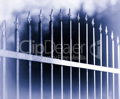 Diagonal bluish sepia fence bokeh background