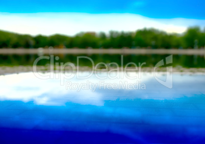 Horizontal forest reflection on street pool bokeh background
