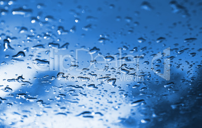 Cyan waterdrops after rain bokeh background