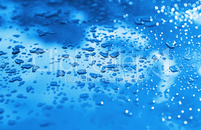 Blue drops after rain bokeh background