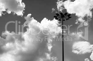 Black and white city lamp with dramatic clouds background