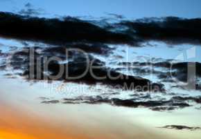 Horizontal vibrant dramatic sunset cloudscape background backdro