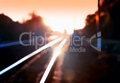 Diagonal burning sunset railway bokeh background