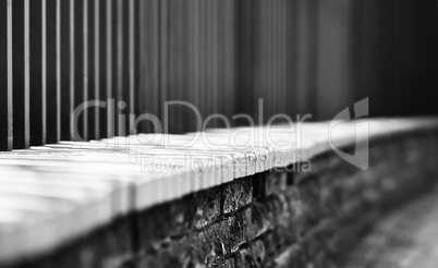 Horizontal black and white dramatic fence bokeh background