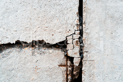 Vertical rusty crack in concrete textured background