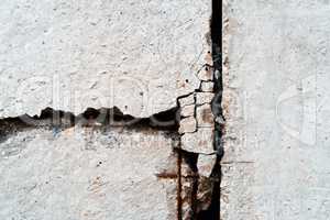 Vertical rusty crack in concrete textured background