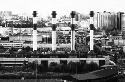 Horizontal black and white industrial chimneys Moscow cityscape