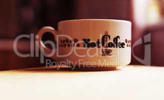 Horizontal hot cup of coffee bokeh background
