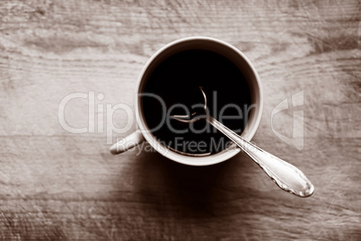 Horizontal cup with spoon bokeh background